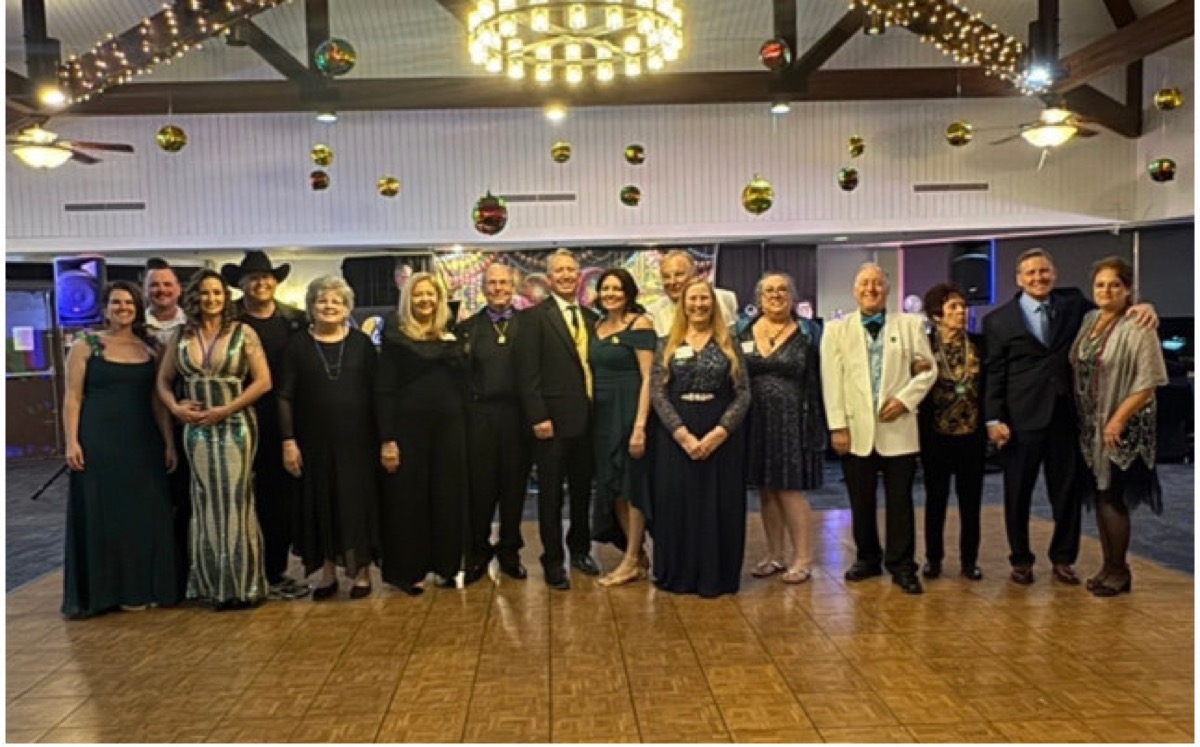 Members and guests gathered on the dance floor at the Mardi Gras Charity Ball