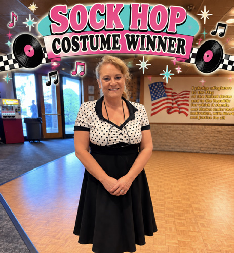 The Sock Hop costume winner posing in the Lodge ballroom